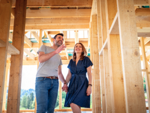 New home buyers walking through new construction build